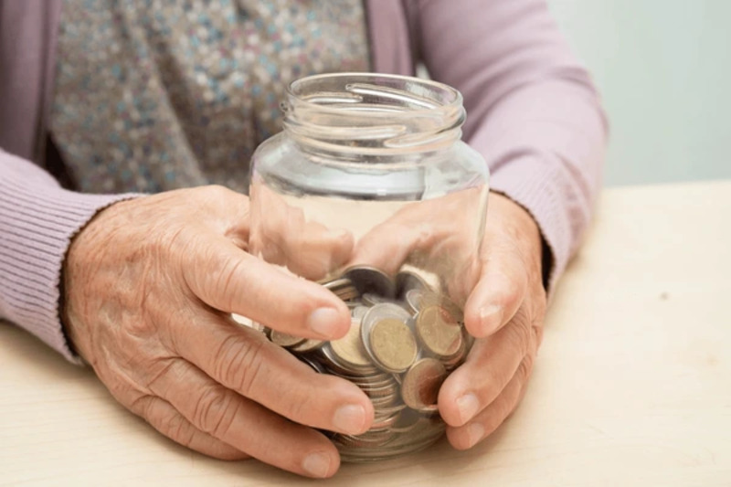 retired asian elderly woman counting 600nw 2707157839