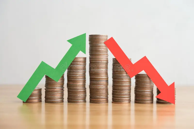 stack coins arrow red green graph chart volatility up down wooden table background business financial investment concept 381102874